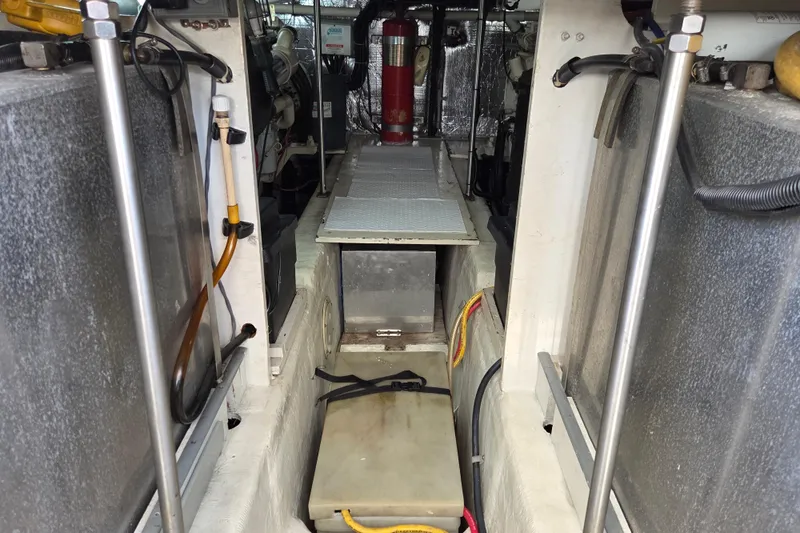 Pier Pressure Yacht Photos Pics Engine room of 2000 Carver 450 Voyager Pilothouse with visible equipment and wiring.