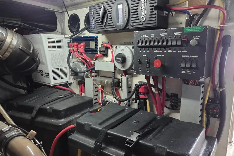 Pier Pressure Yacht Photos Pics Engine room of 2000 Carver 450 Voyager Pilothouse with electrical panel and battery setup.