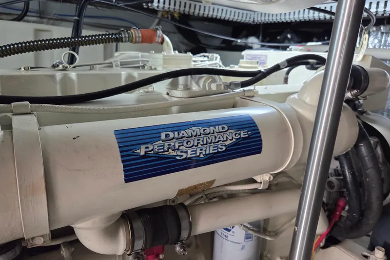Pier Pressure Yacht Photos Pics Engine compartment of 2000 Carver 450 Voyager Pilothouse, featuring Diamond Performance Series component.