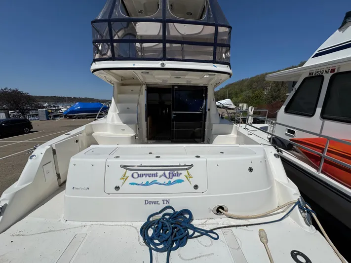 Current Affair Yacht Photos Pics 2005 Sea Ray 500 Sedan Bridge yacht docked, featuring spacious deck and upper helm.