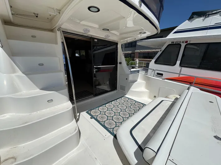 Current Affair Yacht Photos Pics 2005 Sea Ray 500 Sedan Bridge Fresh Water yacht interior with stairs and seating area.