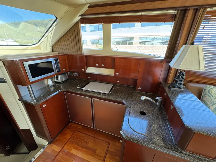 Current Affair Yacht Photos Pics Luxurious kitchen area in 2005 Sea Ray 500 Sedan Bridge yacht with modern amenities.
