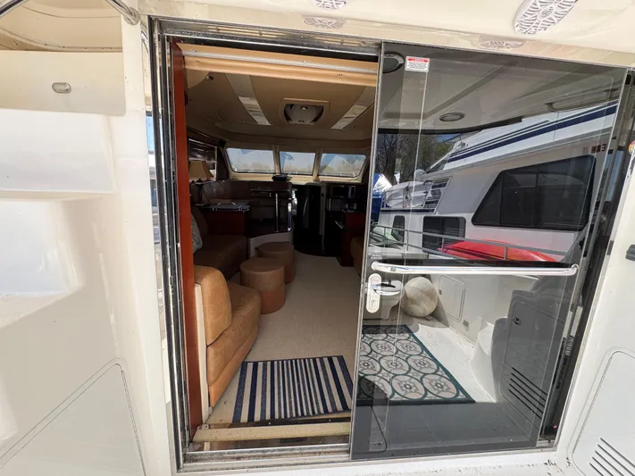 Current Affair Yacht Photos Pics 2005 Sea Ray 500 Sedan Bridge yacht interior view through glass door.