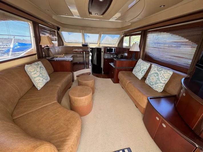 Current Affair Yacht Photos Pics Luxurious interior of 2005 Sea Ray 500 Sedan Bridge yacht with plush seating and elegant decor.