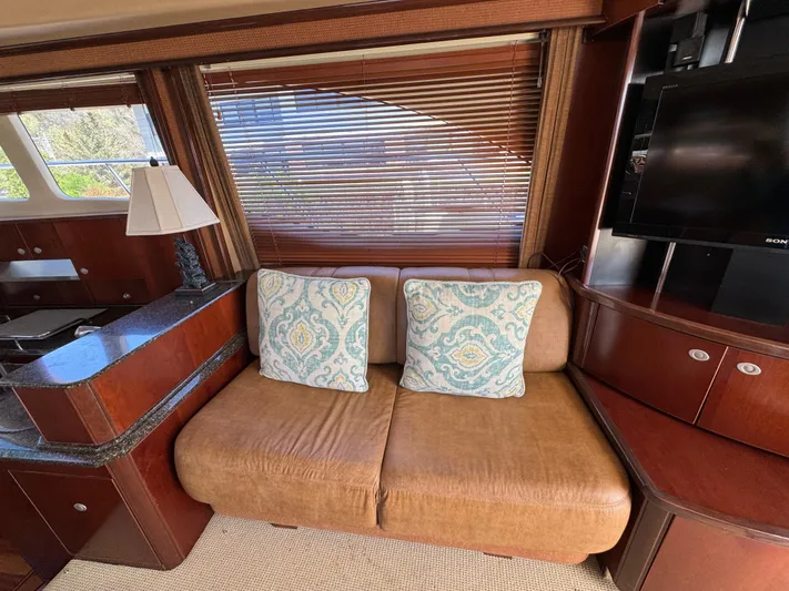 Current Affair Yacht Photos Pics Luxurious interior of 2005 Sea Ray 500 Sedan Bridge yacht with cozy seating and elegant decor.