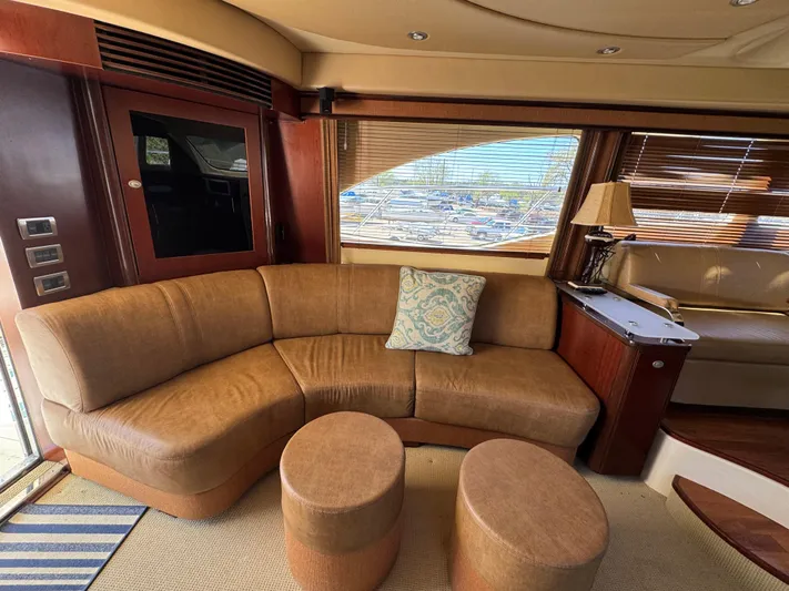 Current Affair Yacht Photos Pics Luxurious interior of 2005 Sea Ray 500 Sedan Bridge yacht with leather seating and elegant decor.