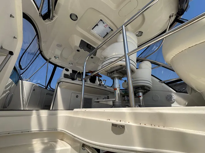 Current Affair Yacht Photos Pics 2005 Sea Ray 500 Sedan Bridge interior with modern helm and seating area.