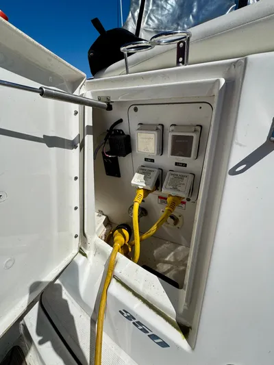 Pendragon Yacht Photos Pics Electrical panel on a 2009 Sea Ray 350 Sundancer boat with power cables connected.