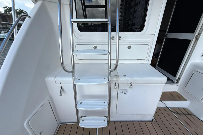  Yacht Photos Pics Stainless steel ladder on 2003 Riviera 37 Flybridge yacht deck.