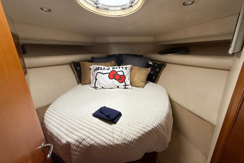  Yacht Photos Pics Cozy bedroom in 2003 Riviera 37 Flybridge yacht with Hello Kitty pillow.