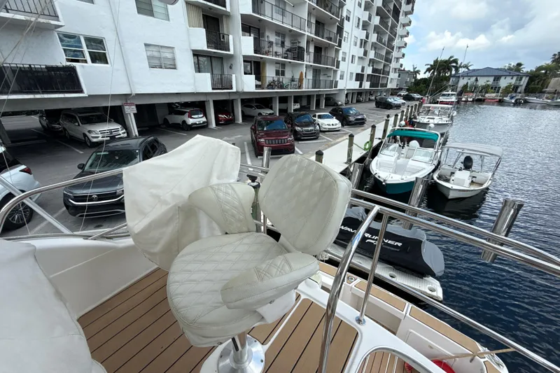 Yacht Photos Pics Flybridge view from 2003 Riviera 37, overlooking marina and parked cars.