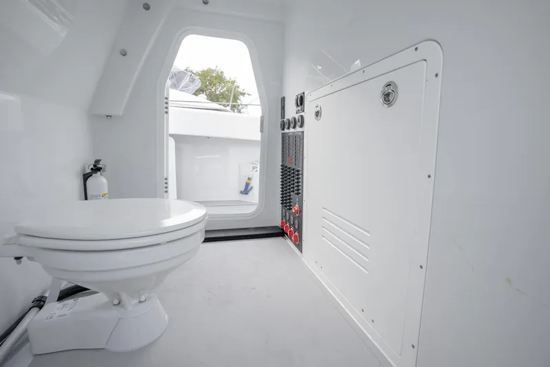  Yacht Photos Pics Freeman 47 boat interior bathroom with toilet and control panel, 2021 model.