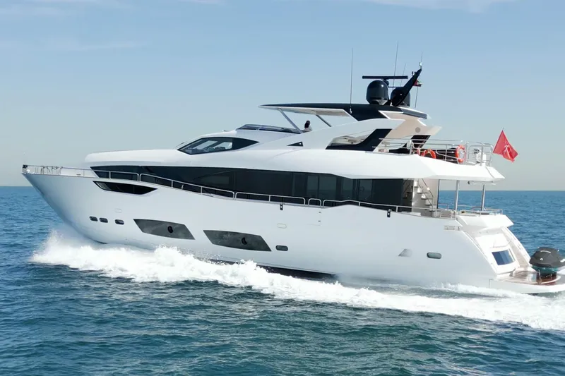  Yacht Photos Pics 2018 Sunseeker 95 Yacht cruising on open sea under clear blue sky.