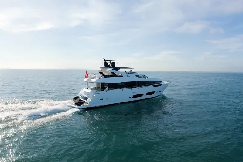  Yacht Photos Pics 2018 Sunseeker 95 Yacht cruising on open sea under clear skies.