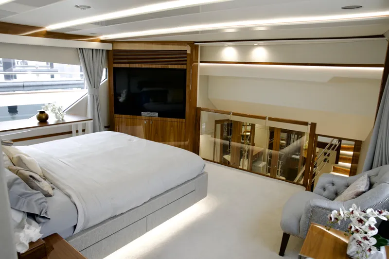  Yacht Photos Pics Luxurious interior of 2018 Sunseeker 95 Yacht, featuring elegant bedroom and modern design elements.
