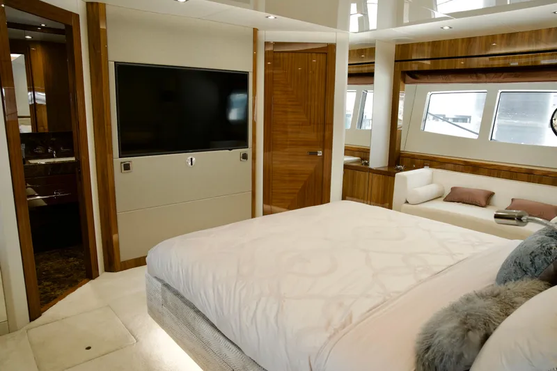  Yacht Photos Pics Luxurious 2018 Sunseeker 95 Yacht bedroom with elegant wood finishes and large TV.