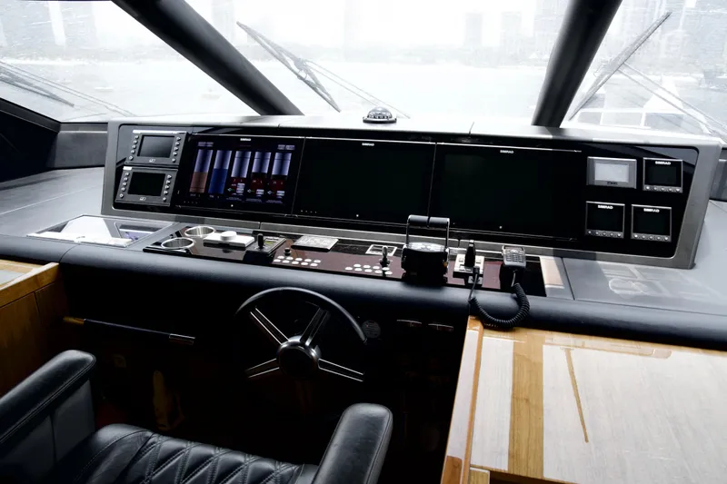  Yacht Photos Pics Cockpit of 2018 Sunseeker 95 Yacht with advanced navigation controls and displays.
