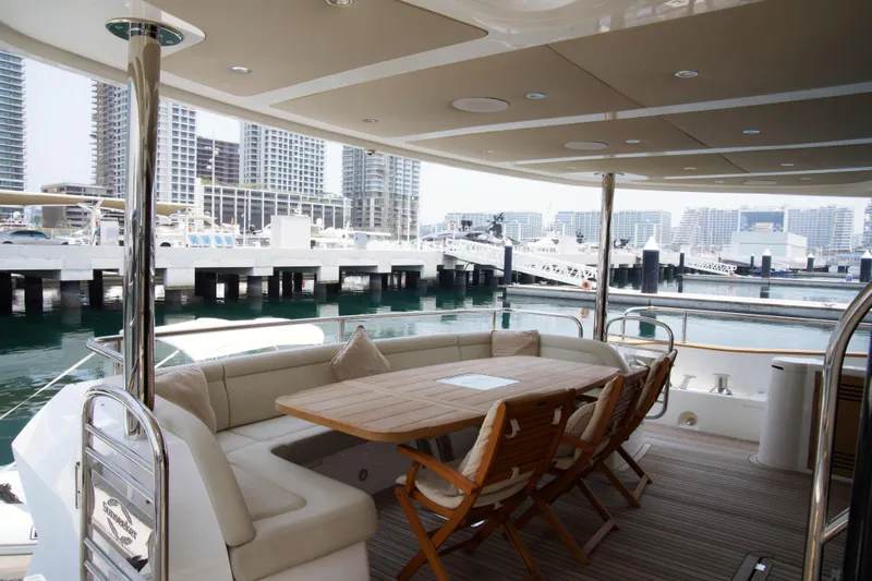  Yacht Photos Pics Luxurious 2018 Sunseeker 95 Yacht with elegant outdoor seating at marina.