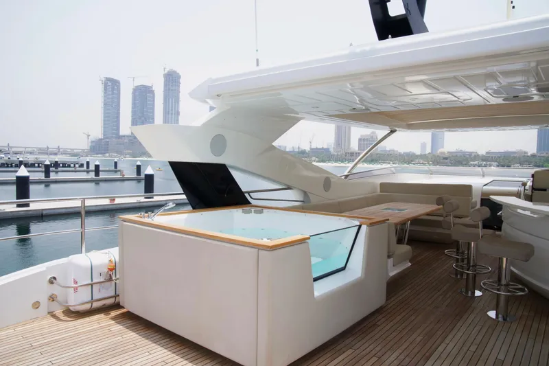  Yacht Photos Pics Luxurious 2018 Sunseeker 95 Yacht with spacious deck and modern amenities in marina setting.