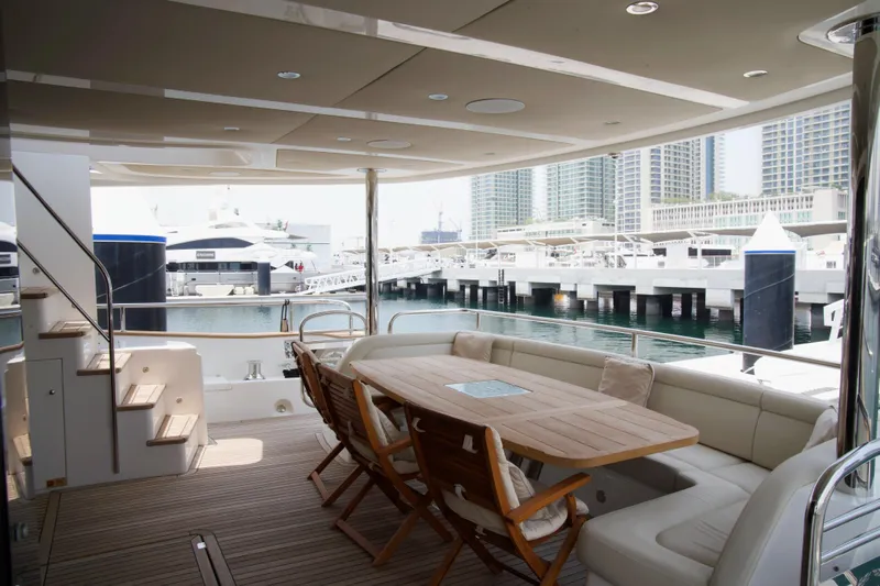  Yacht Photos Pics Luxurious Sunseeker 95 Yacht 2018 with elegant outdoor seating and marina view.