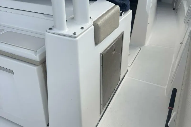  Yacht Photos Pics 2020 Pursuit S 328 Sport boat interior with storage compartment and seating.