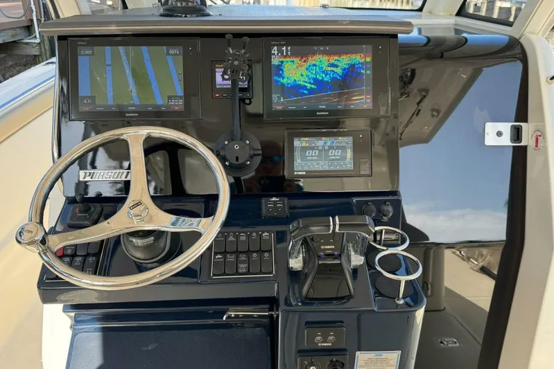  Yacht Photos Pics 2020 Pursuit S 328 Sport boat dashboard with advanced navigation displays and controls.