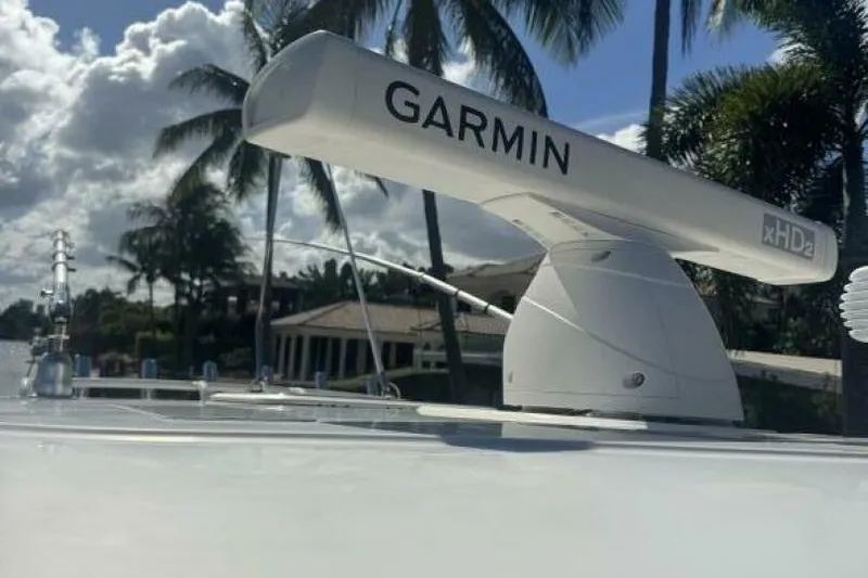  Yacht Photos Pics 2020 Pursuit S 328 Sport boat with Garmin radar, palm trees in background.
