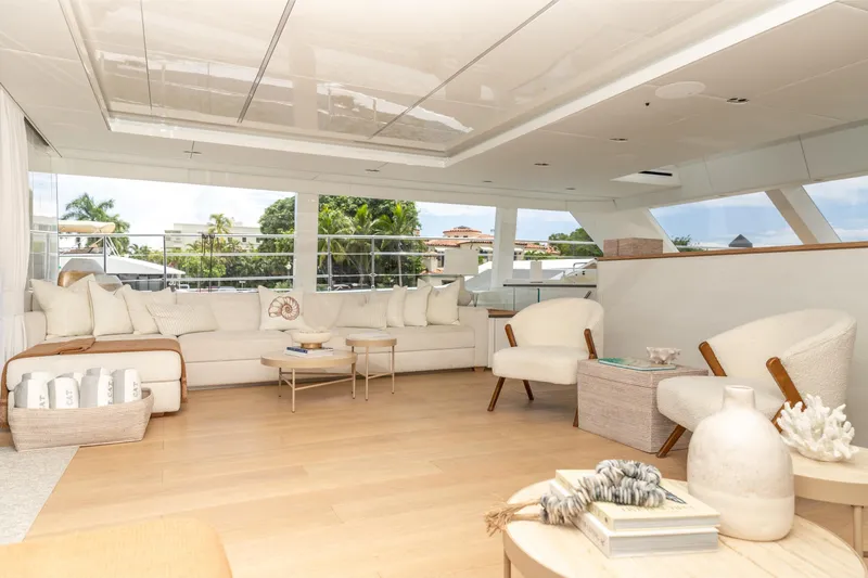 Fat Cat Yacht Photos Pics Luxurious interior of 2024 Sunreef 80 Power yacht with elegant seating and decor.