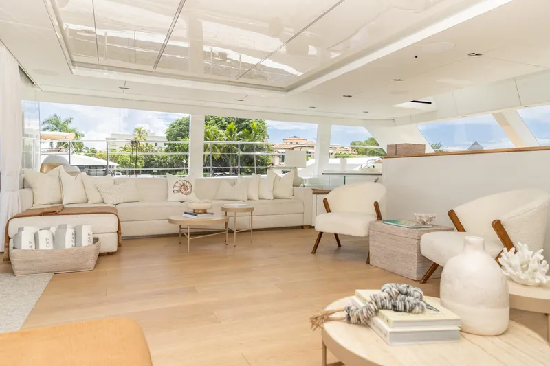 Fat Cat Yacht Photos Pics Luxurious interior of 2024 Sunreef 80 Power yacht with elegant seating and decor.