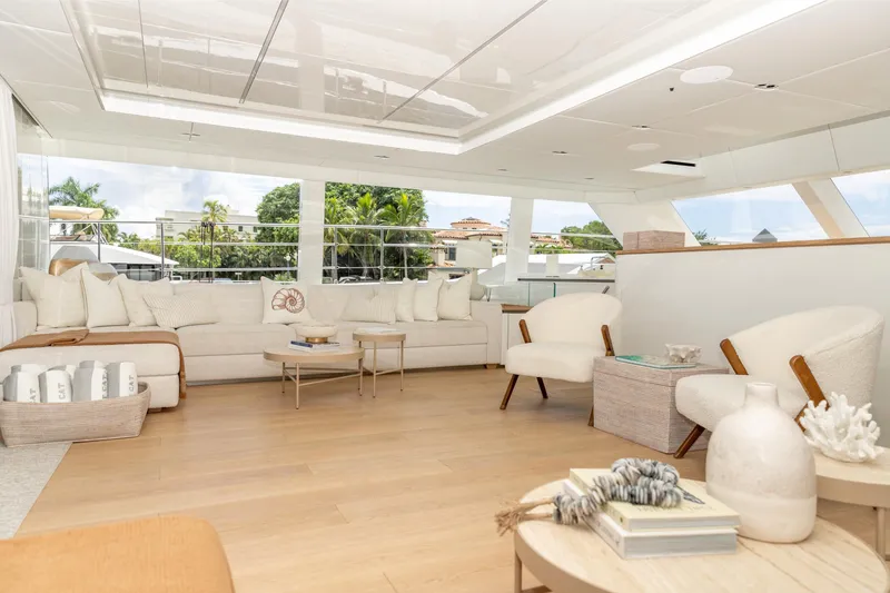 Fat Cat Yacht Photos Pics Luxurious interior of 2024 Sunreef 80 Power yacht with elegant seating and decor.