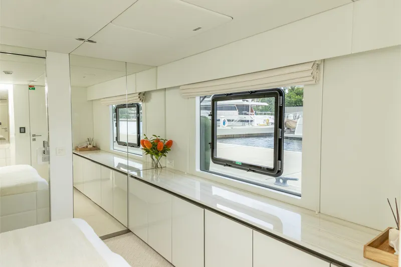 Fat Cat Yacht Photos Pics Luxurious interior of 2024 Sunreef 80 Power yacht with elegant decor and large windows.