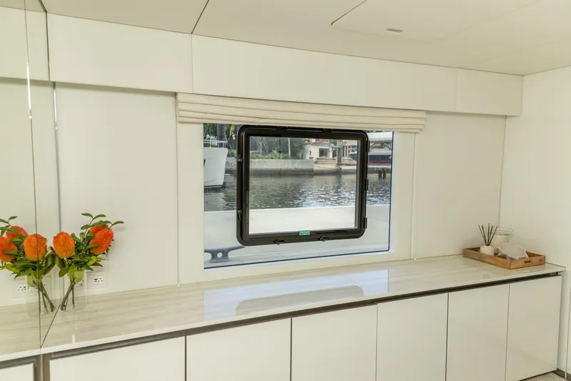 Fat Cat Yacht Photos Pics Interior of 2024 Sunreef 80 Power yacht with window view and elegant decor.