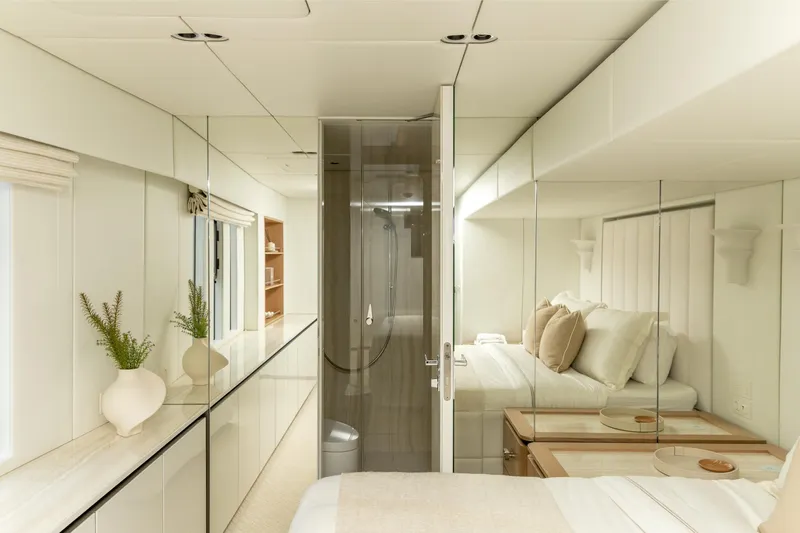 Fat Cat Yacht Photos Pics Luxurious interior of 2024 Sunreef 80 Power yacht with elegant bedroom and modern design.