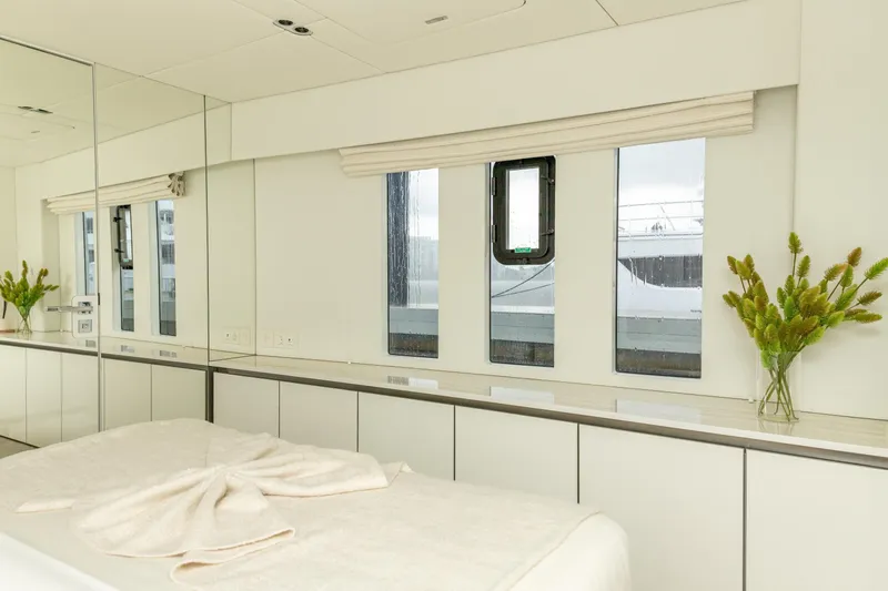 Fat Cat Yacht Photos Pics Luxurious interior of 2024 Sunreef 80 Power yacht with elegant decor and large windows.