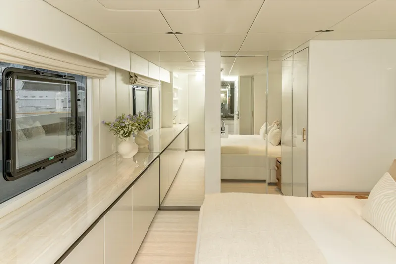 Fat Cat Yacht Photos Pics Luxurious interior of 2024 Sunreef 80 Power yacht, featuring elegant bedroom and modern design.