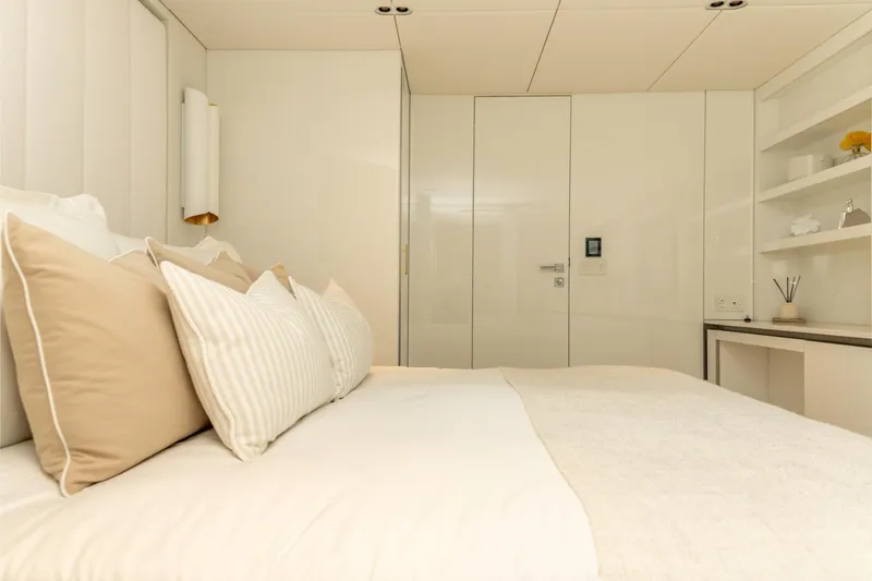 Fat Cat Yacht Photos Pics Luxurious bedroom interior on 2024 Sunreef 80 Power yacht, featuring elegant neutral decor.