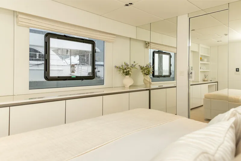 Fat Cat Yacht Photos Pics Luxurious interior of 2024 Sunreef 80 Power yacht, featuring elegant bedroom design.