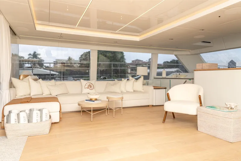 Fat Cat Yacht Photos Pics Luxurious interior of 2024 Sunreef 80 Power yacht with elegant seating and modern decor.