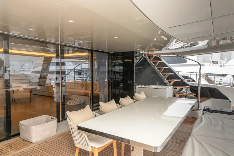 Fat Cat Yacht Photos Pics Luxurious Sunreef 80 Power yacht interior, featuring elegant dining area and modern design, 2024 model.
