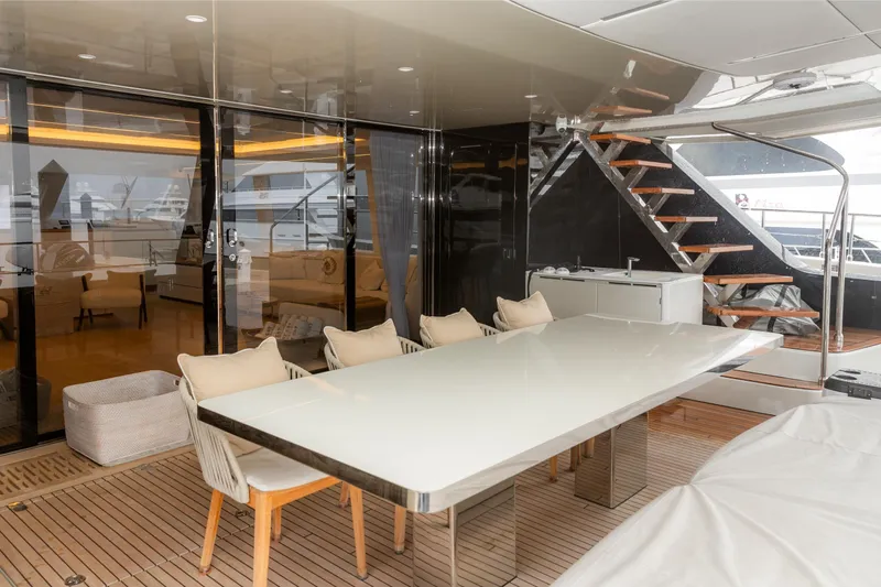 Fat Cat Yacht Photos Pics Luxurious Sunreef 80 Power yacht interior with elegant dining area, modern design, 2024 model.