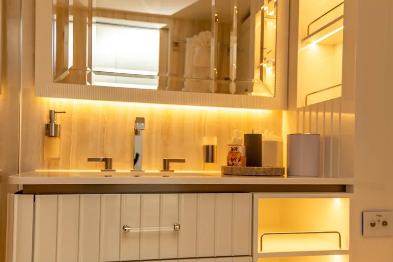 Fat Cat Yacht Photos Pics Luxurious bathroom vanity on 2024 Sunreef 80 Power yacht, featuring modern lighting and sleek design.