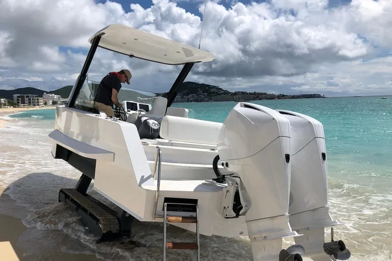  Yacht Photos Pics 2019 IGUANA Yachts Commuter on beach with dual engines and retractable tracks.