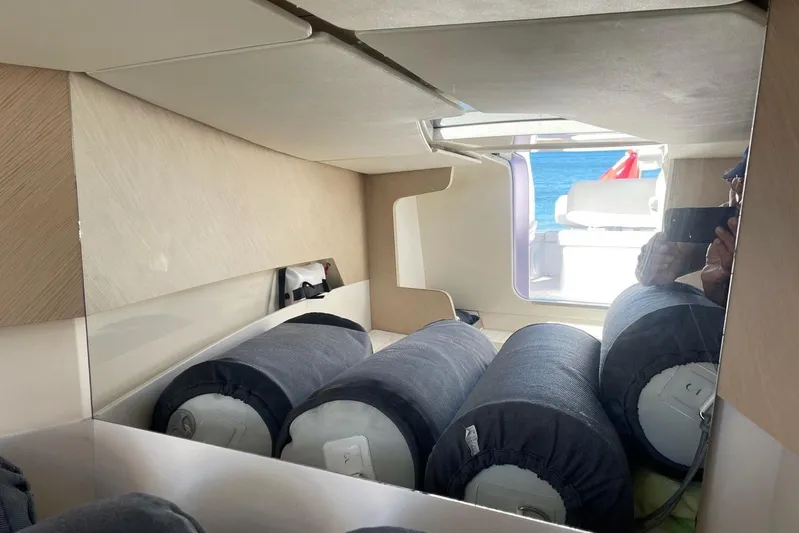  Yacht Photos Pics Interior of 2019 IGUANA Yachts Commuter with storage and seating area.