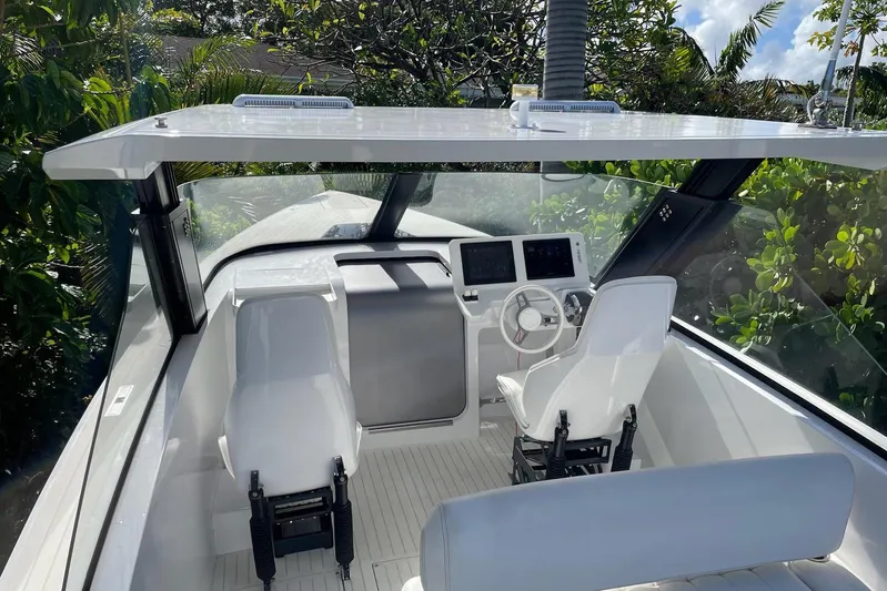  Yacht Photos Pics Interior of 2019 IGUANA Yachts Commuter, featuring sleek design and modern controls.