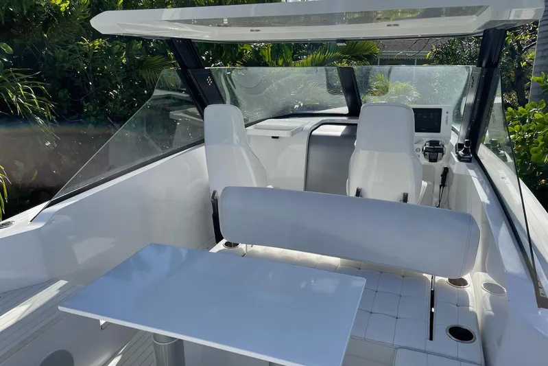  Yacht Photos Pics Interior of 2019 IGUANA Yachts Commuter with sleek seating and modern dashboard.