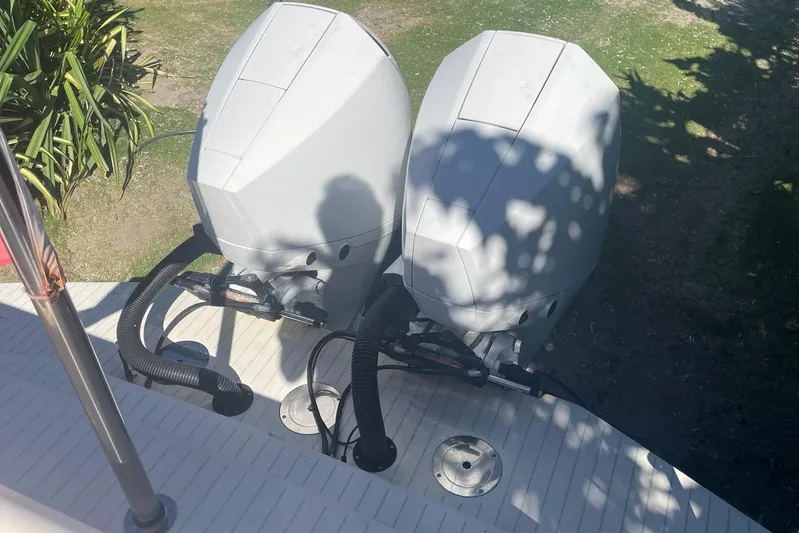  Yacht Photos Pics Twin outboard motors on a 2019 IGUANA Yachts Commuter, viewed from above.