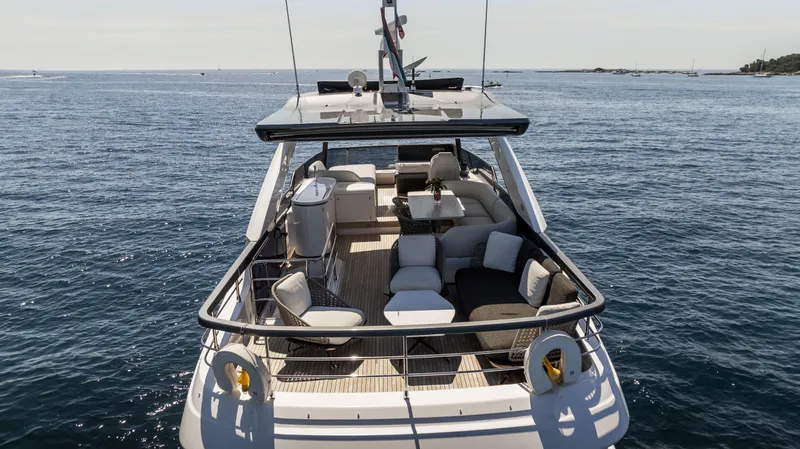  Yacht Photos Pics Luxurious 2023 Azimut Fly 68 yacht with spacious deck on open sea.