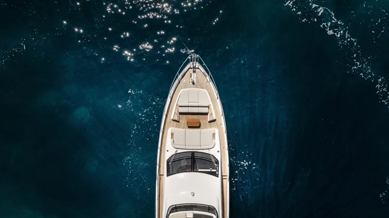  Yacht Photos Pics Aerial view of 2023 Azimut Fly 68 yacht on sparkling blue water.