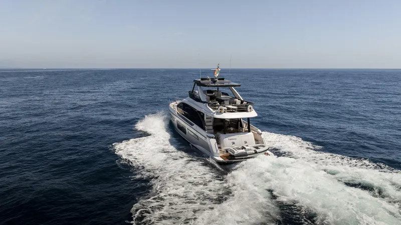 Yacht Photos Pics 2023 Azimut Fly 68 yacht cruising on open sea.
