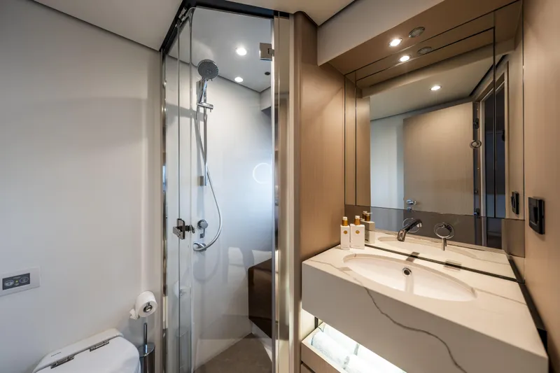  Yacht Photos Pics Luxurious bathroom in 2023 Azimut Fly 68 yacht with modern shower and elegant vanity.